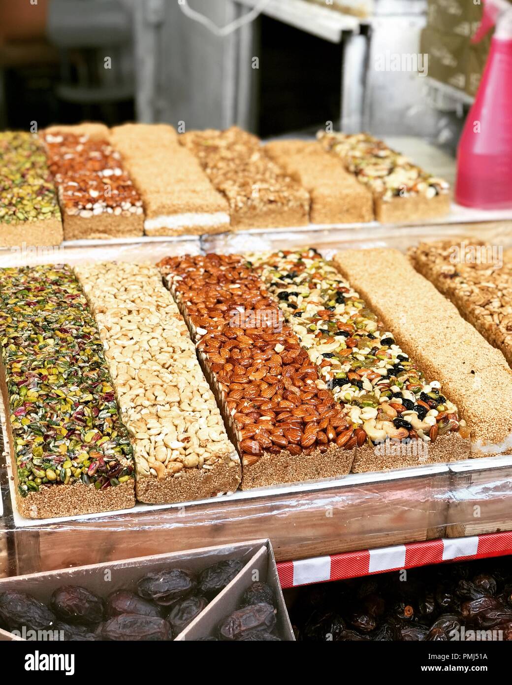 Halva confectionery with nuts in a street market, Israel Stock Photo