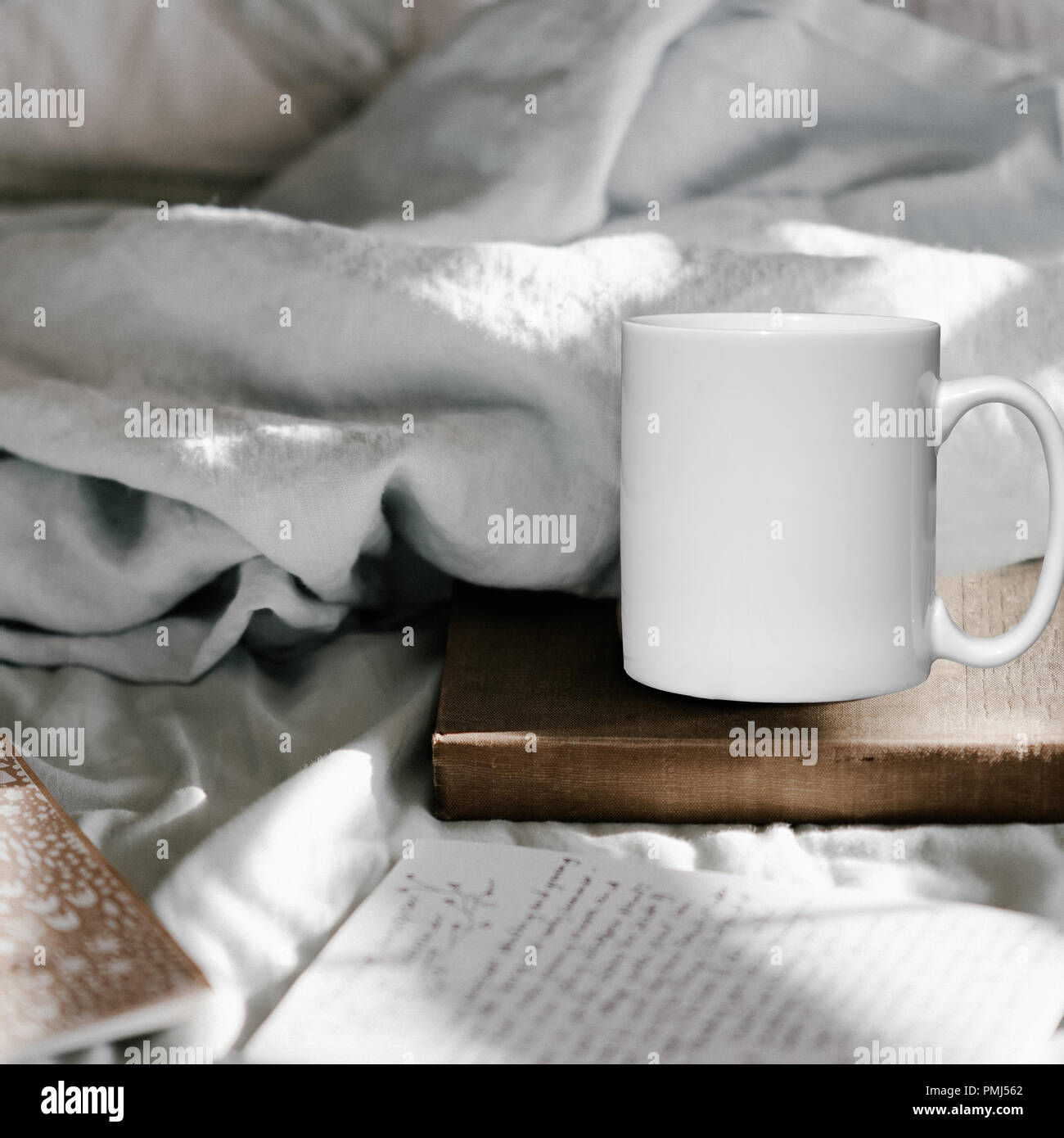 Winter styled white blank coffee mug to add custom design or quote. Perfect for businesses selling mugs, just overlay your quote or design on to the i Stock Photo