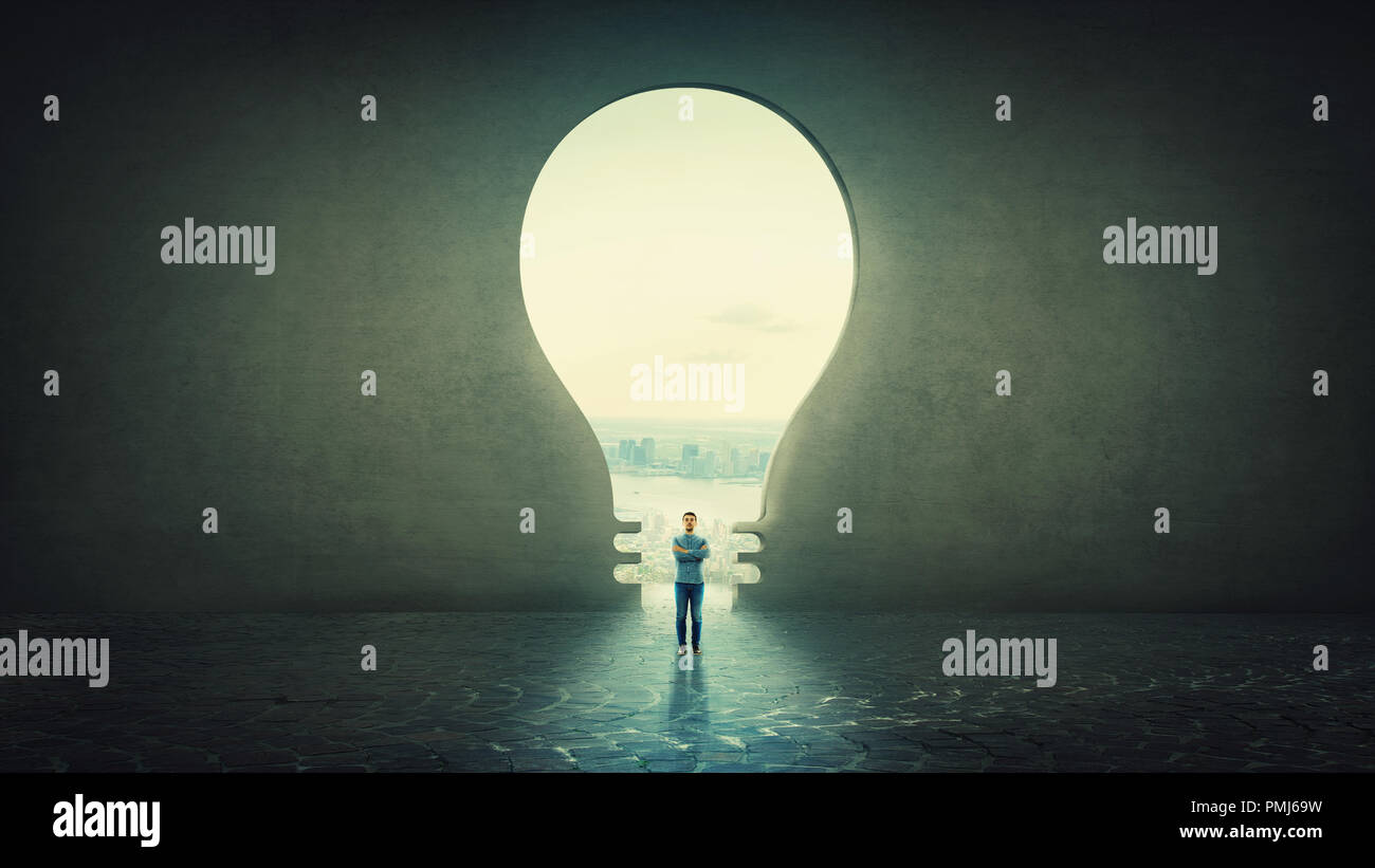Lightbulb in front concrete wall hi-res stock photography and images ...