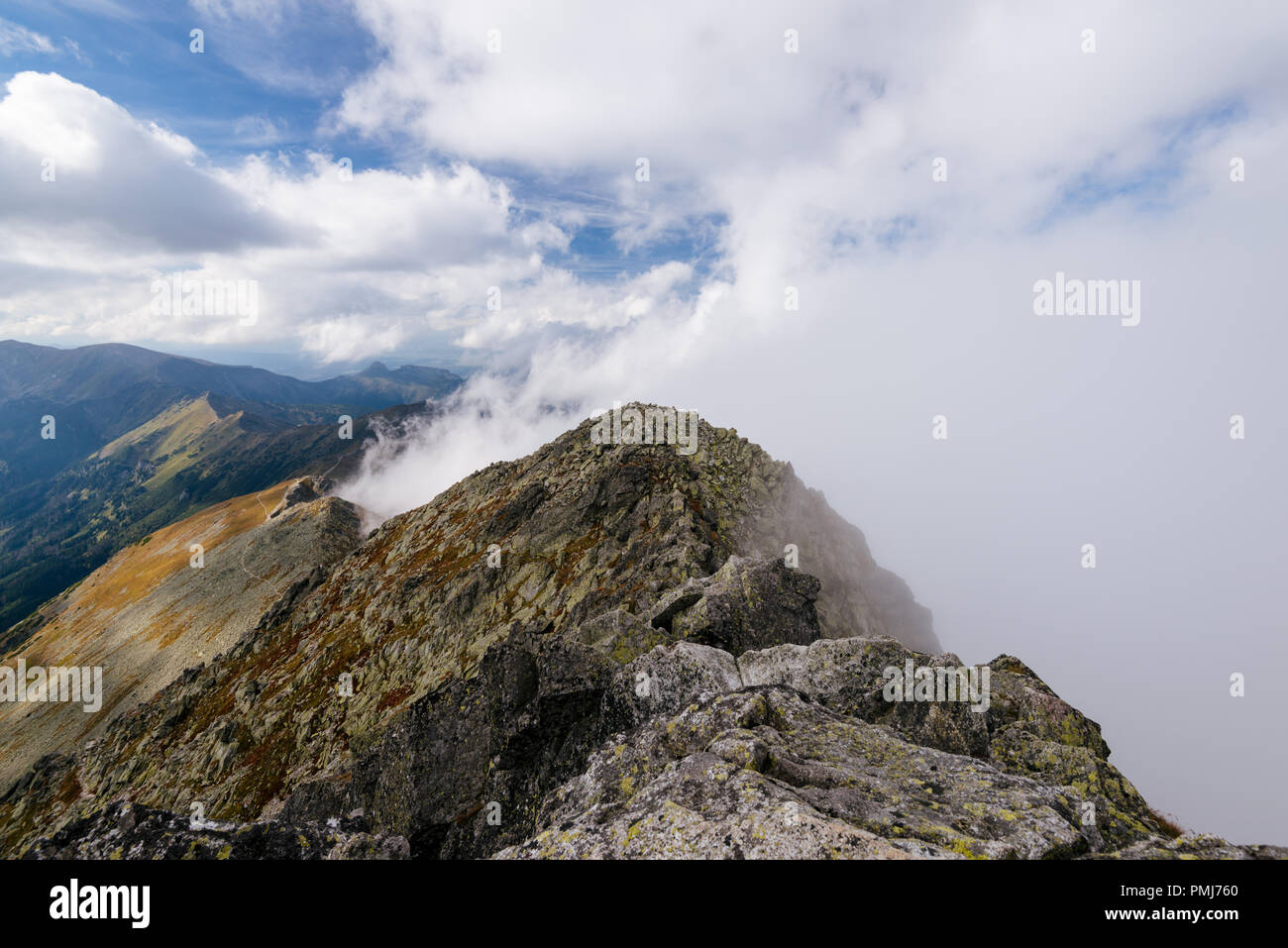 Cloud covered mountain peaks in the High Tatra Stock Photo - Alamy