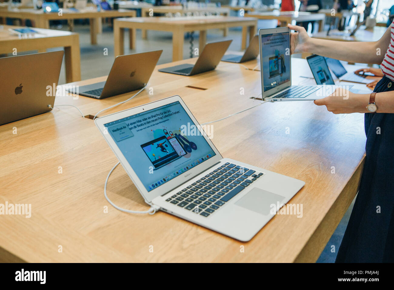 Berlin, August 29, 2018: Retail sale of new MacBooks in the official store of Apple in Berlin. Modern and stylish laptops. Stock Photo