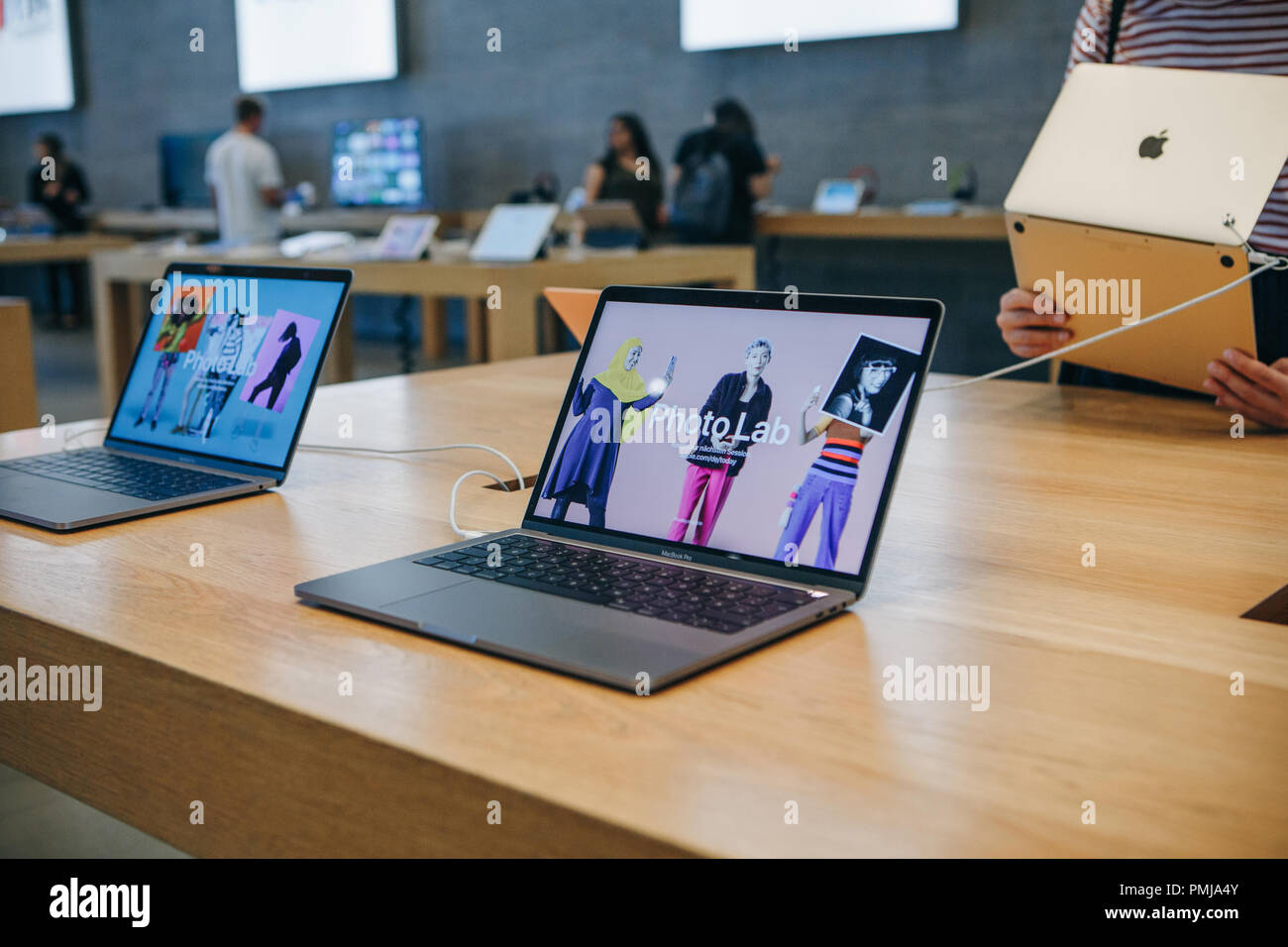 Berlin, August 29, 2018: Retail sale of new MacBooks in the official store of Apple in Berlin. Modern and stylish laptops. Stock Photo