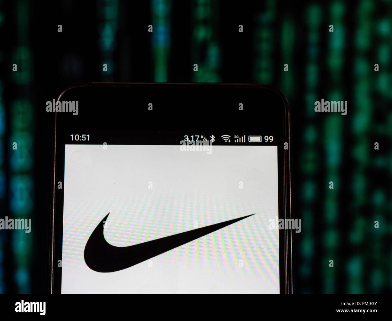 Nike Footwear manufacturing company logo seen displayed on a smart phone.  Nike, Inc. is an American multinational corporation that is engaged in the  design, development, manufacturing, and worldwide marketing and sales of