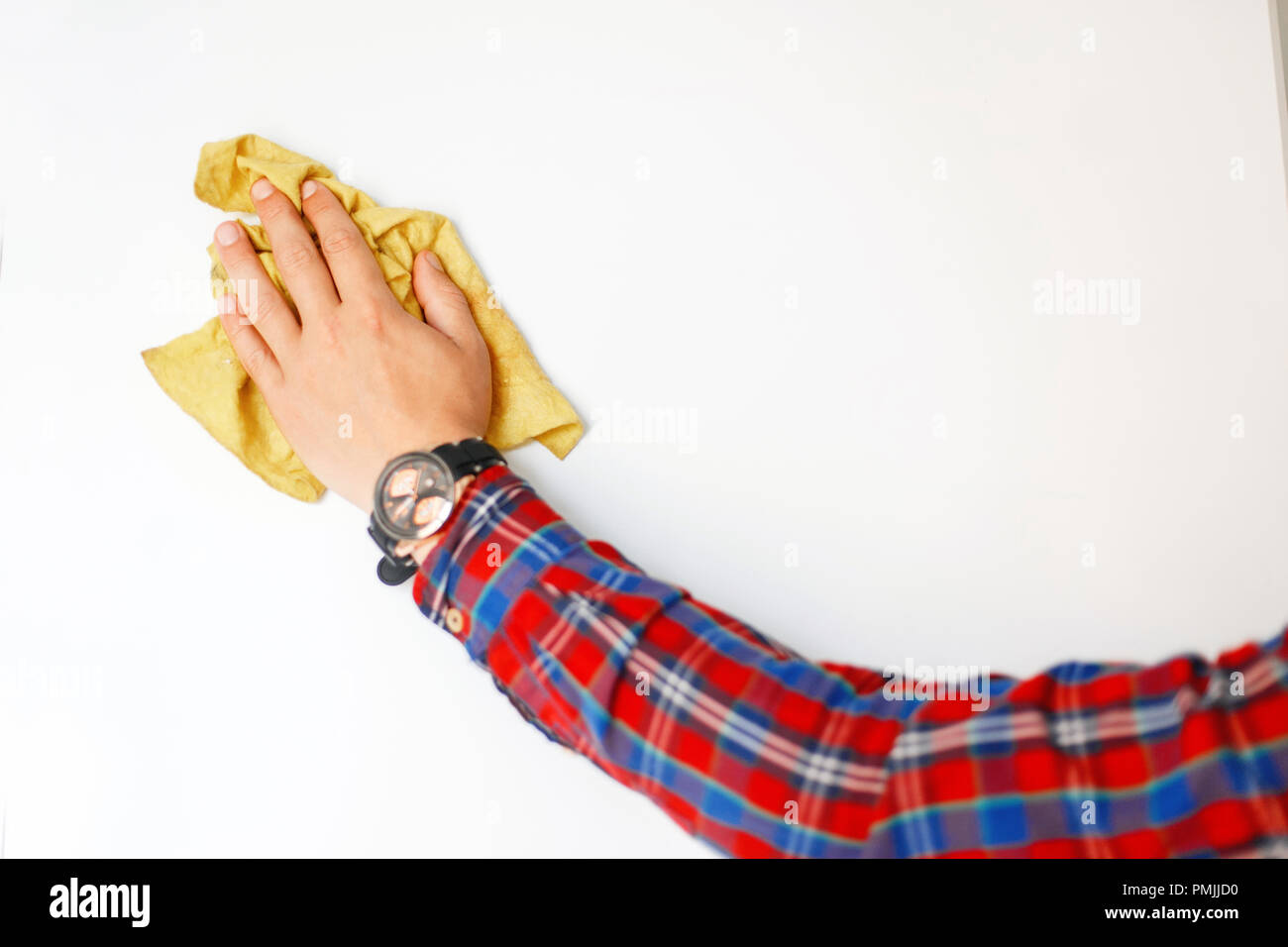 man's hand with a rag wipes the white board Stock Photo - Alamy