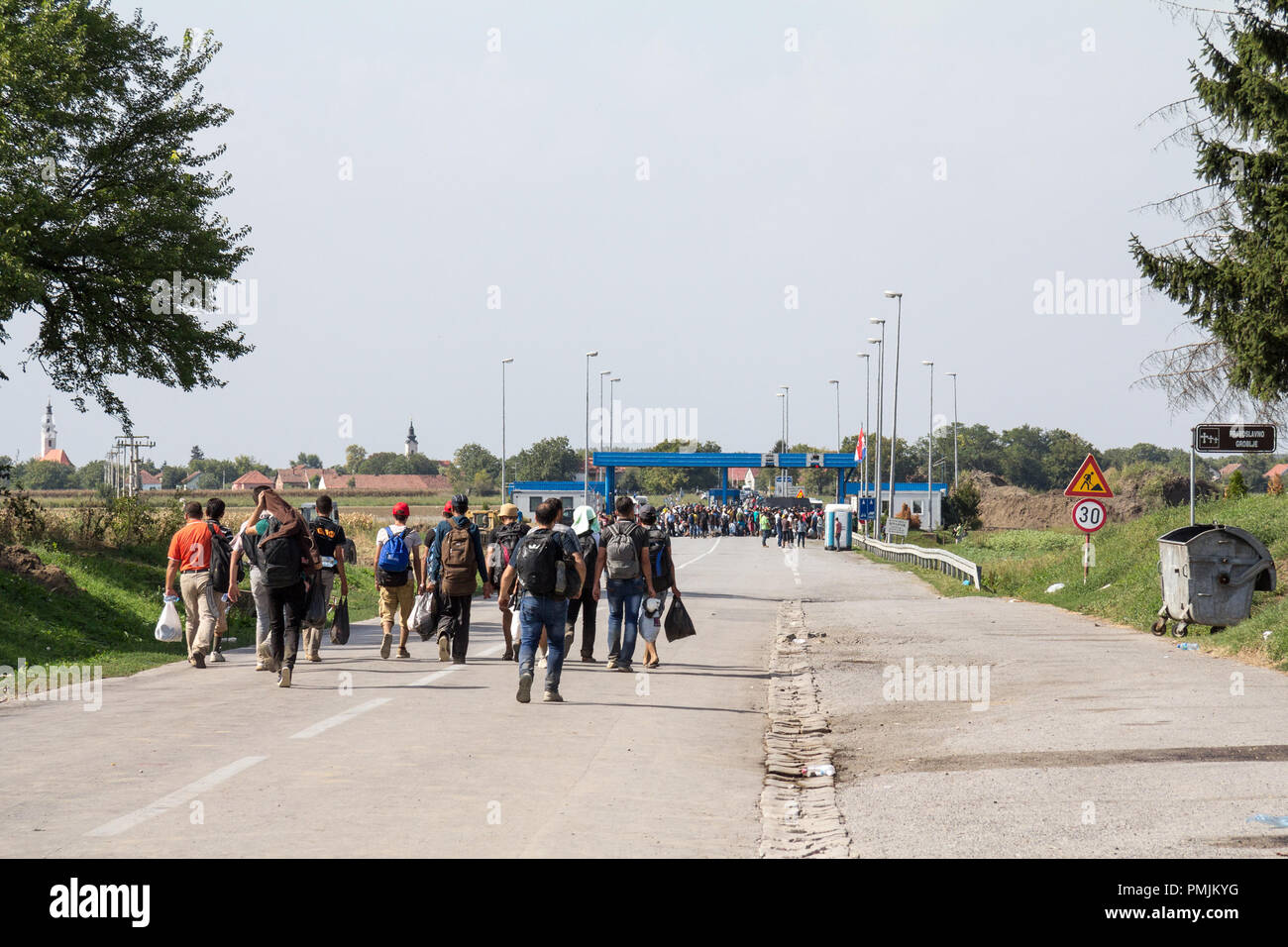 TOVARNIK, CROATIA - SEPTEMBER 19, 2015: Refugees gathering in front of the Serbia-Croatia border crossing of Sid Tovarnik on the Balkans Route, during Stock Photo