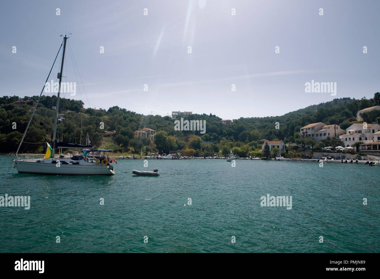 At anchor in the bay of Agios Stefanos, Corfu, Greece Stock Photo