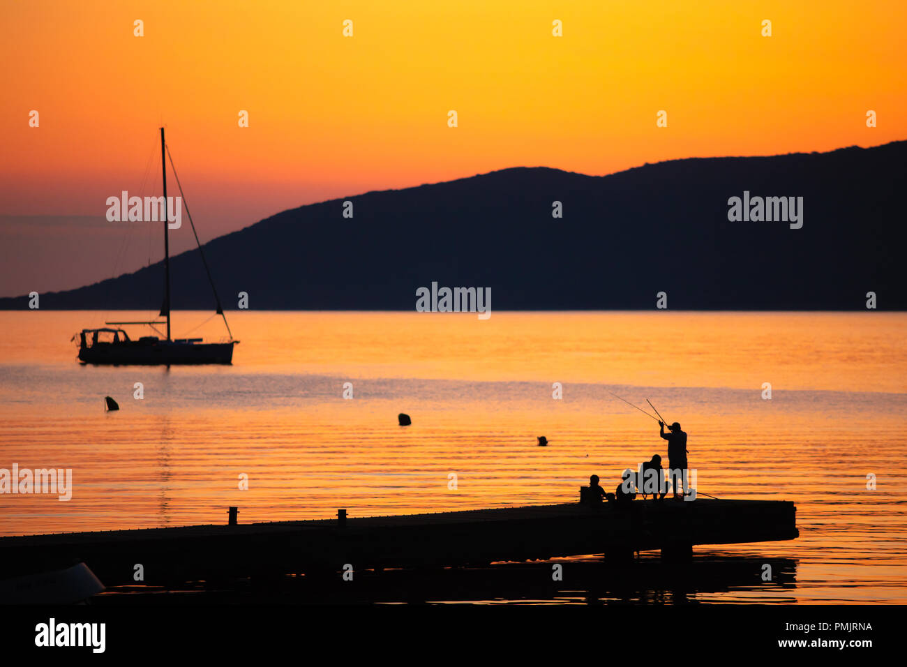 Silhouette man fishing on beach hi-res stock photography and images - Alamy