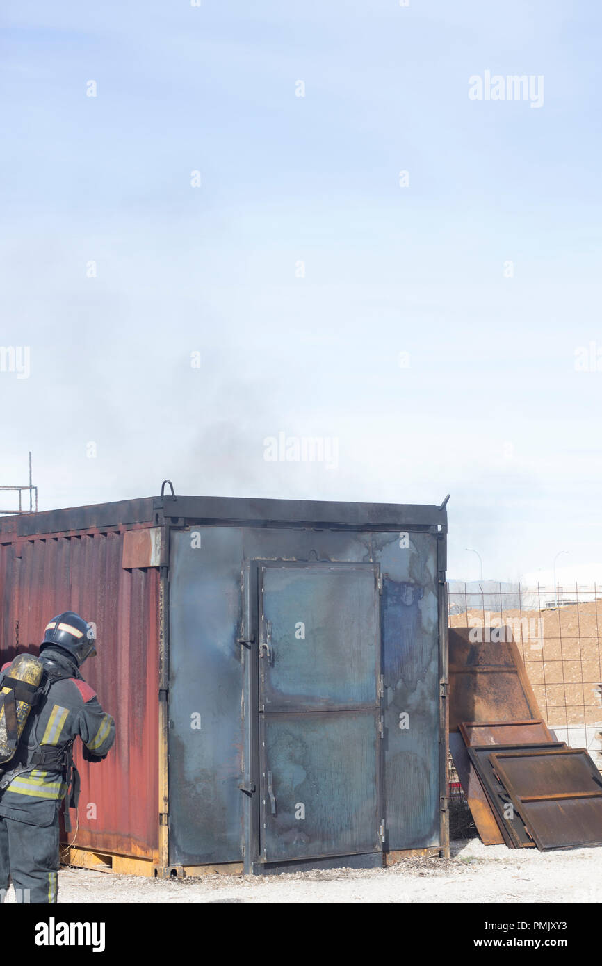Firefighter putting out fire training station extinguisher backdraft ...