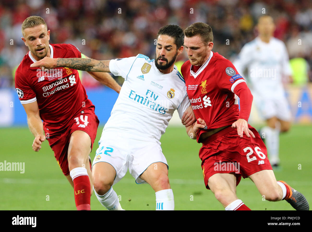 KYIV, UKRAINE - MAY 26, 2018: Isco of Real Madrid (C) fights for a ball with Jordan Henderson (L) and Andy Robertson of Liverpool during their UEFA Ch Stock Photo