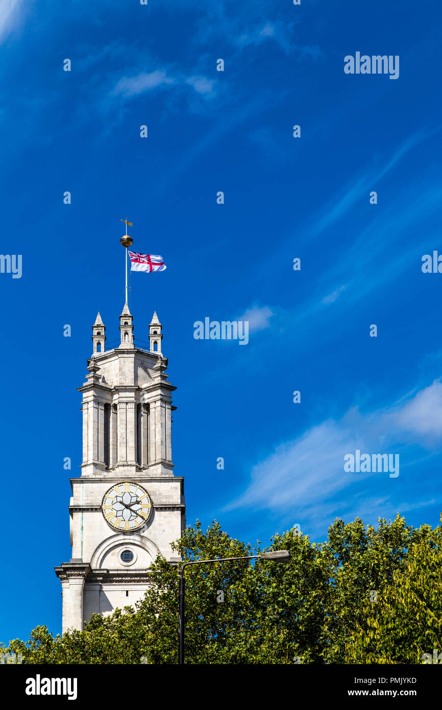St Anne's Limehouse bell tower flying the white ensign, London, UK Stock Photo