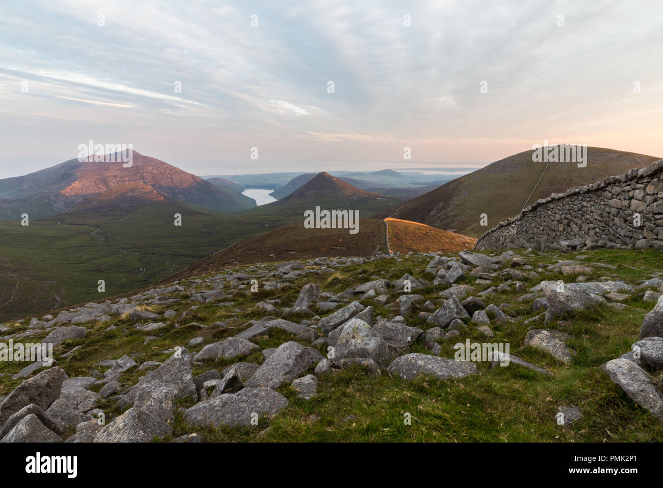View to Doan Mountain in the heart of the Mourne Mountains in late evening sunlight Stock Photo