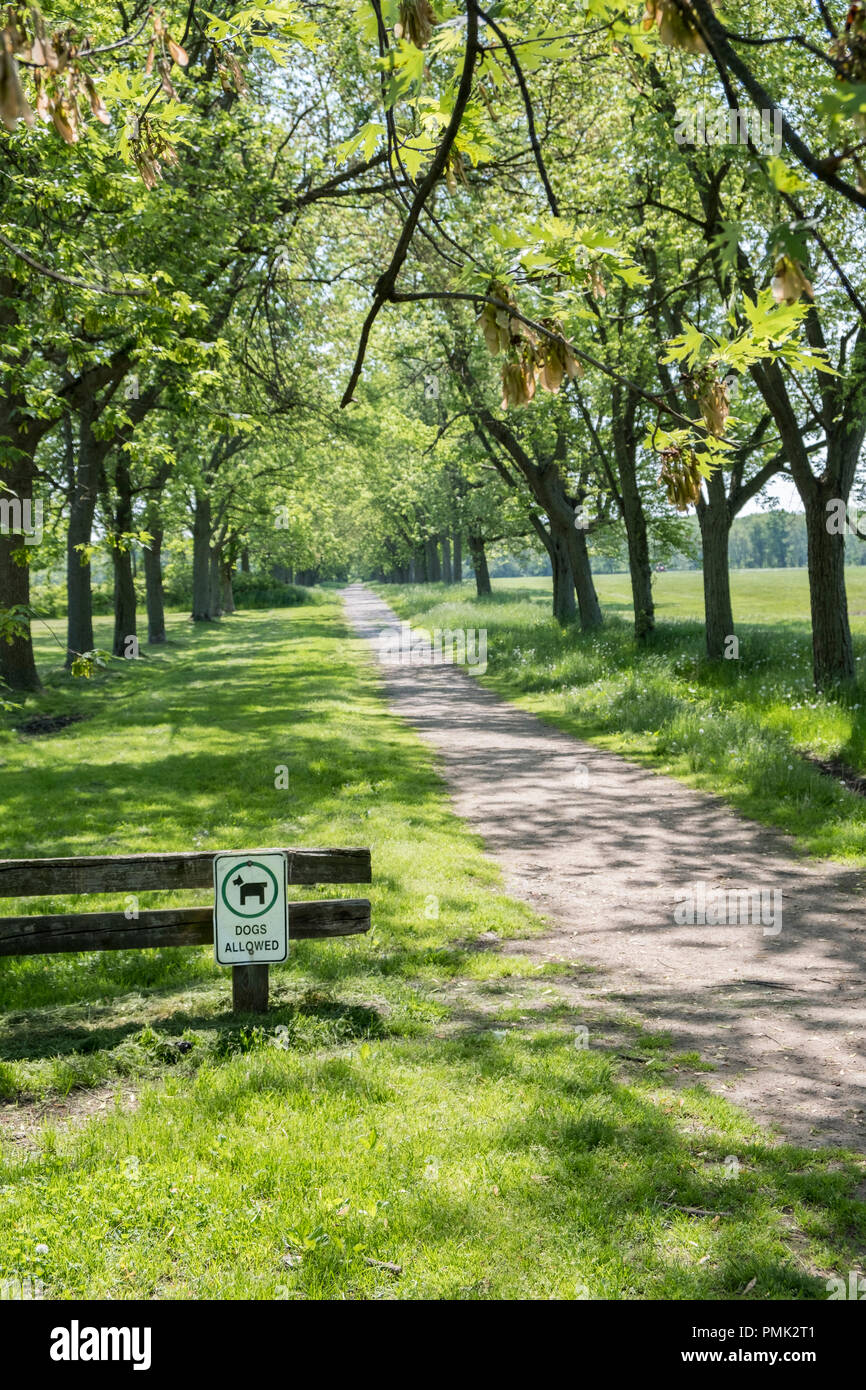 A dogs allowed sign at the entrance to an off leash dog park in Niagara on the Lake, Ontario,Canada. Stock Photo