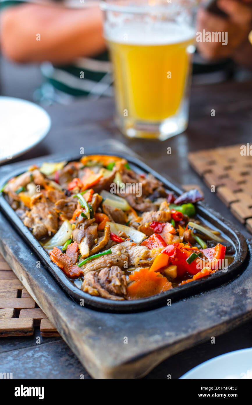 beef stir vegetable hot dish food menu serve with beer on the table ...