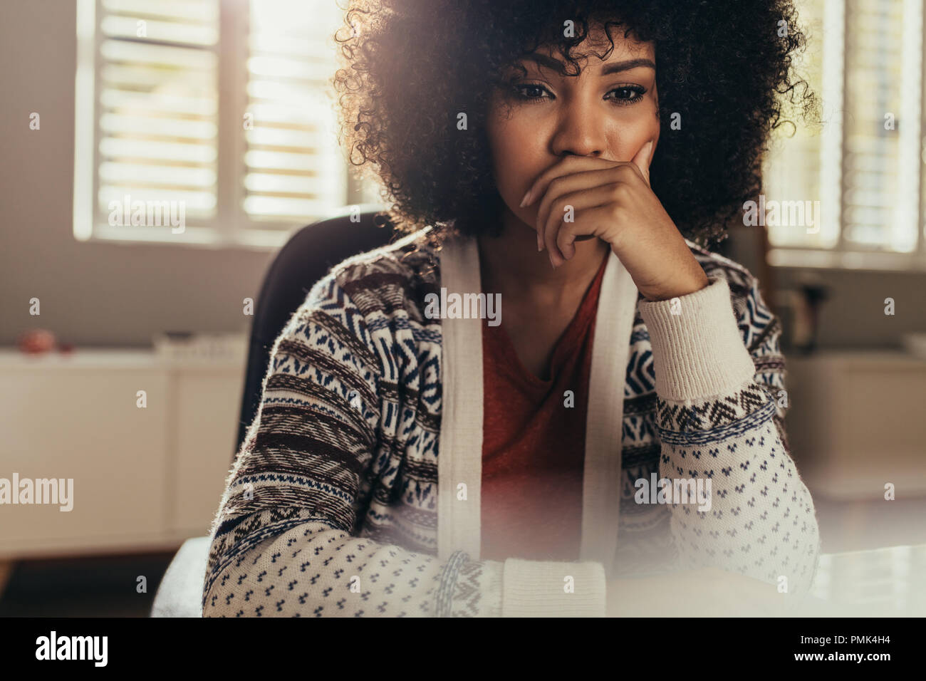 Young female architect thinking about new ideas. Woman designer sitting in office and working on new project. Stock Photo
