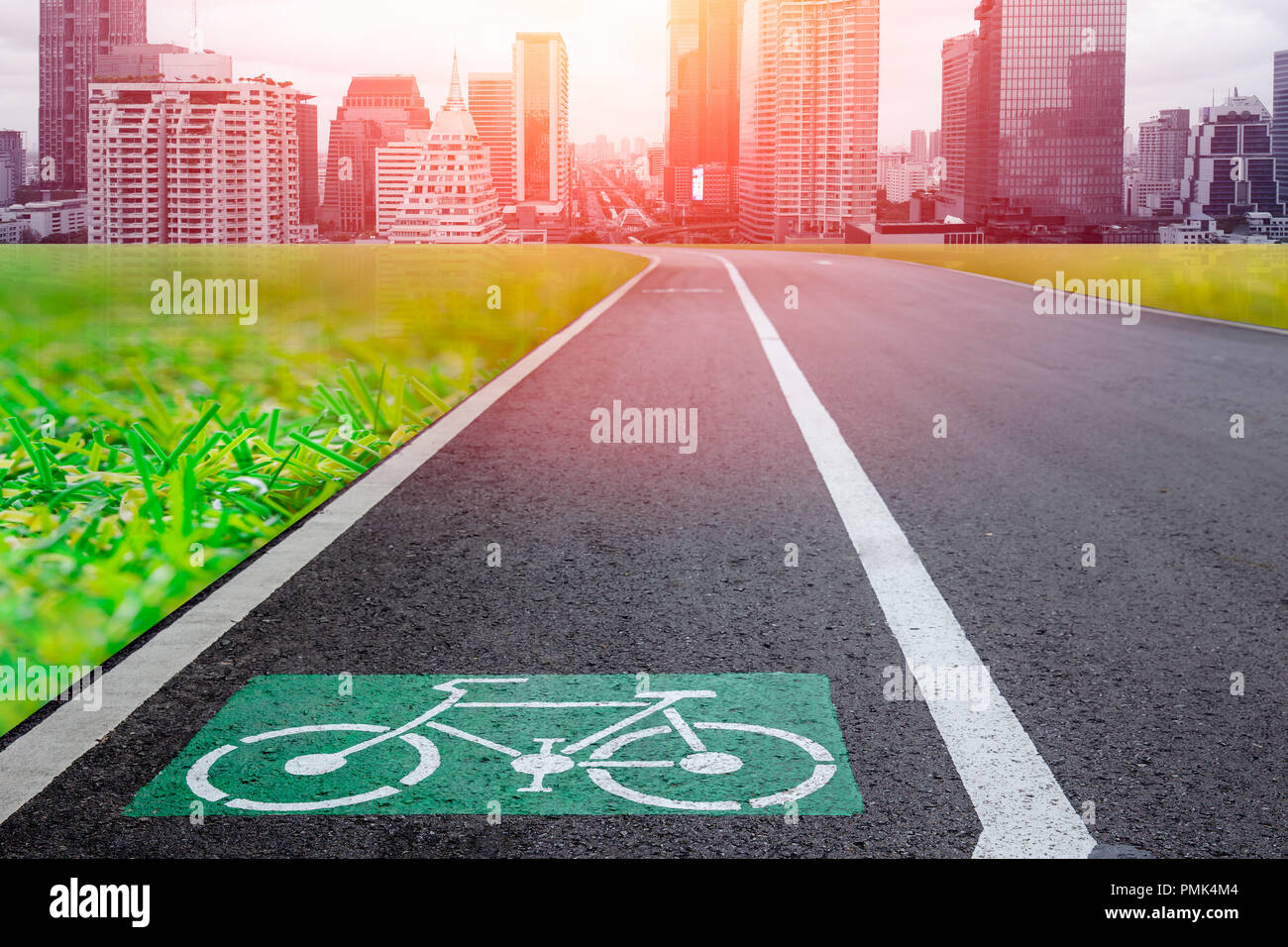bike lane with futuristic city metro building for eco green transport system in urban concept Stock Photo