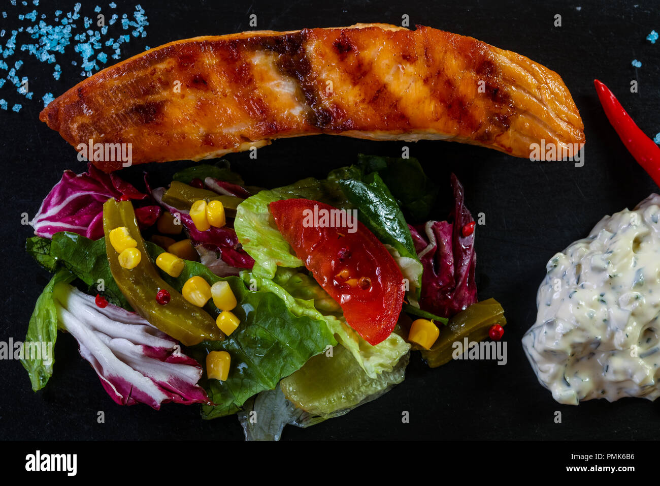 Grilled salmon steak with sauce Stock Photo - Alamy