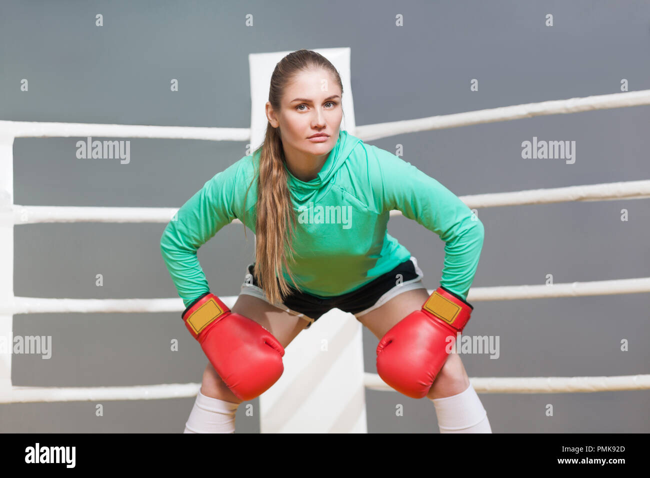 An athletic woman in boxers gloves posing for the camera Stock Photo - Alamy