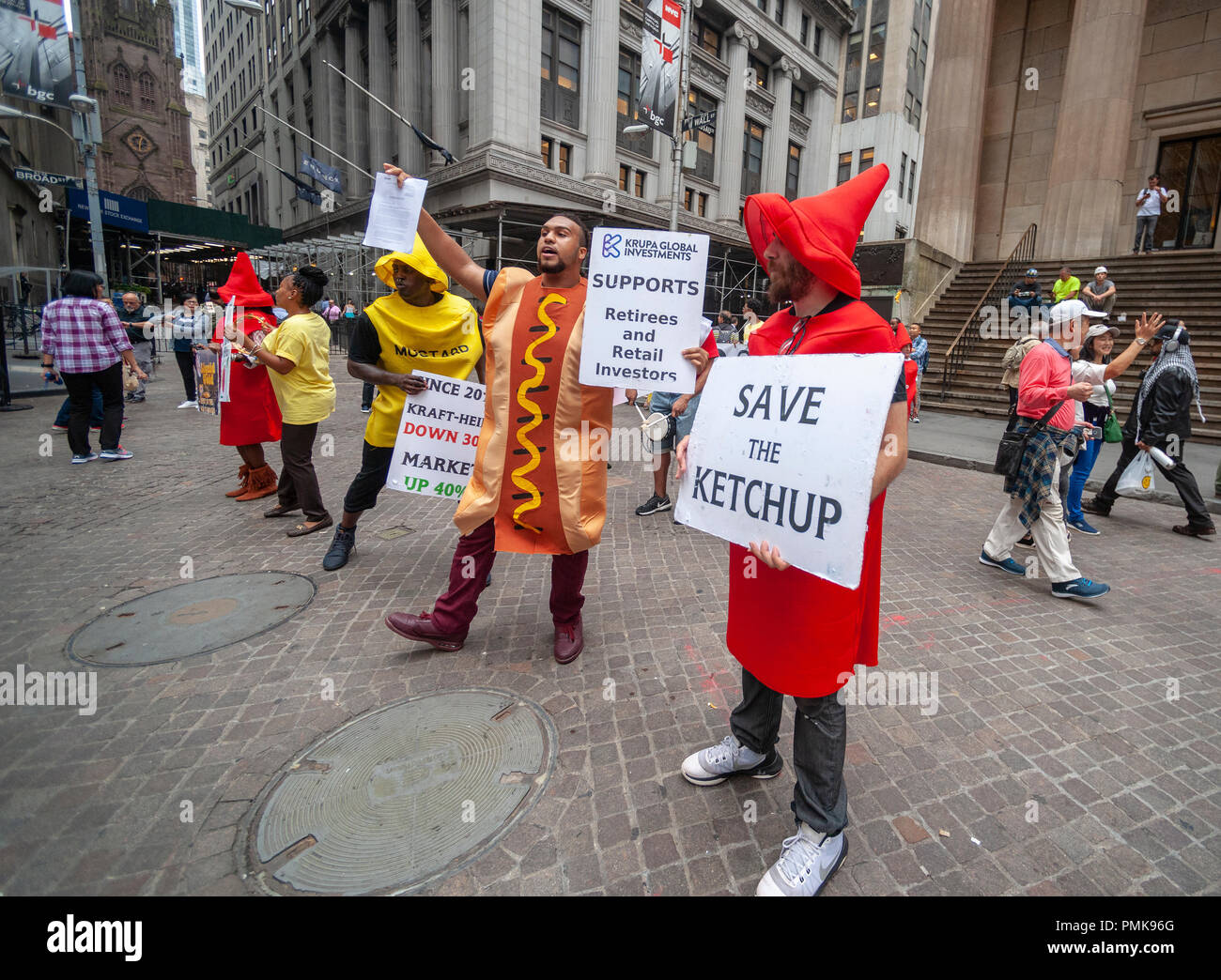 Protesters from Krupa Global Investments dressed as iconic ketchup and mustard bottles protest on Wednesday, September 12, 2018 the management of the Kraft Heinz Company by Berkshire Hathaway and 3G Capital, fearful that the investors are abandoning the company. Krupa wants the company, which has seen its share price drop, to take a number of steps to ensure a fair return to investors even if Kraft Heinz has to be taken private. KGI owns approximately $100 million of Kraft Heinz stock. (Â© Richard B. Levine) Stock Photo