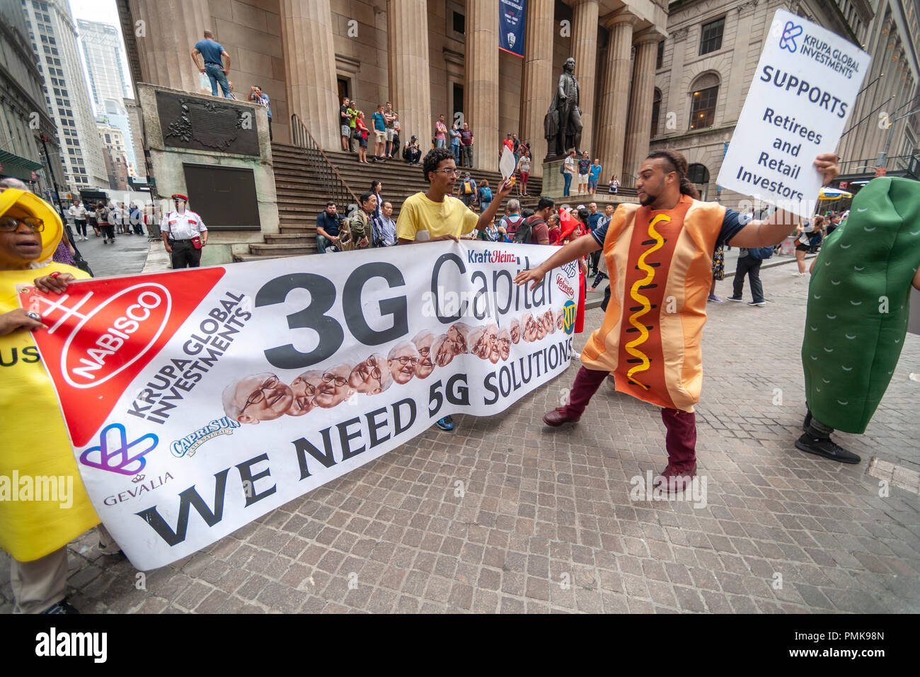 Protesters from Krupa Global Investments dressed as iconic ketchup and ...