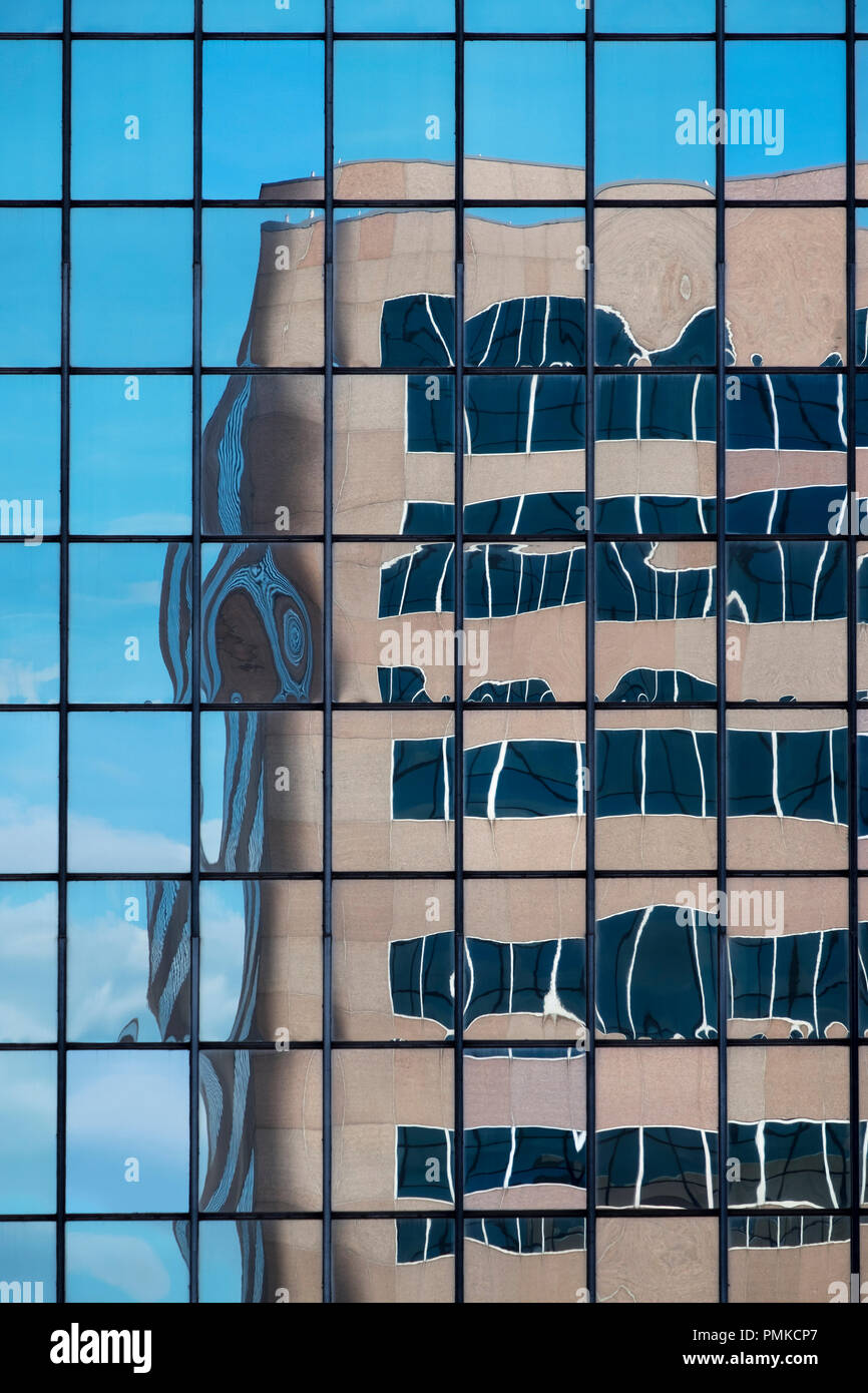 Architecture detail in office block, Birmingham alabama. A distorted reflection of an office block in the reflective windows of another office block. Stock Photo