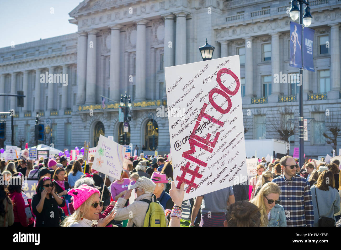 January 20, 2018 San Francisco / CA / USA - 'Me too' sign raised high by a Women's March participant; the City Hall building in the background Stock Photo