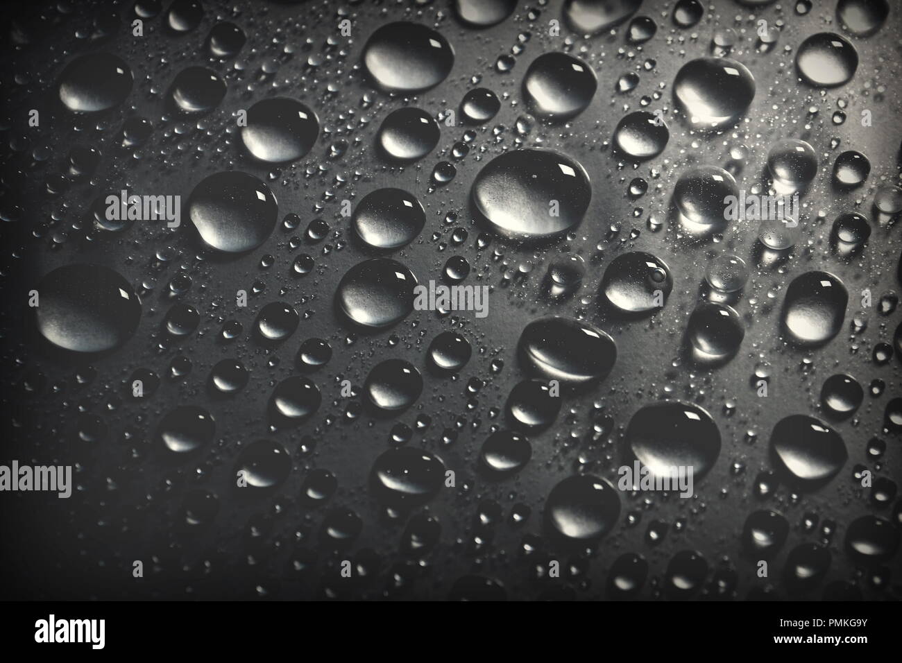 shiny water drops on black background. for designer, cover, web header page templates. Stock Photo