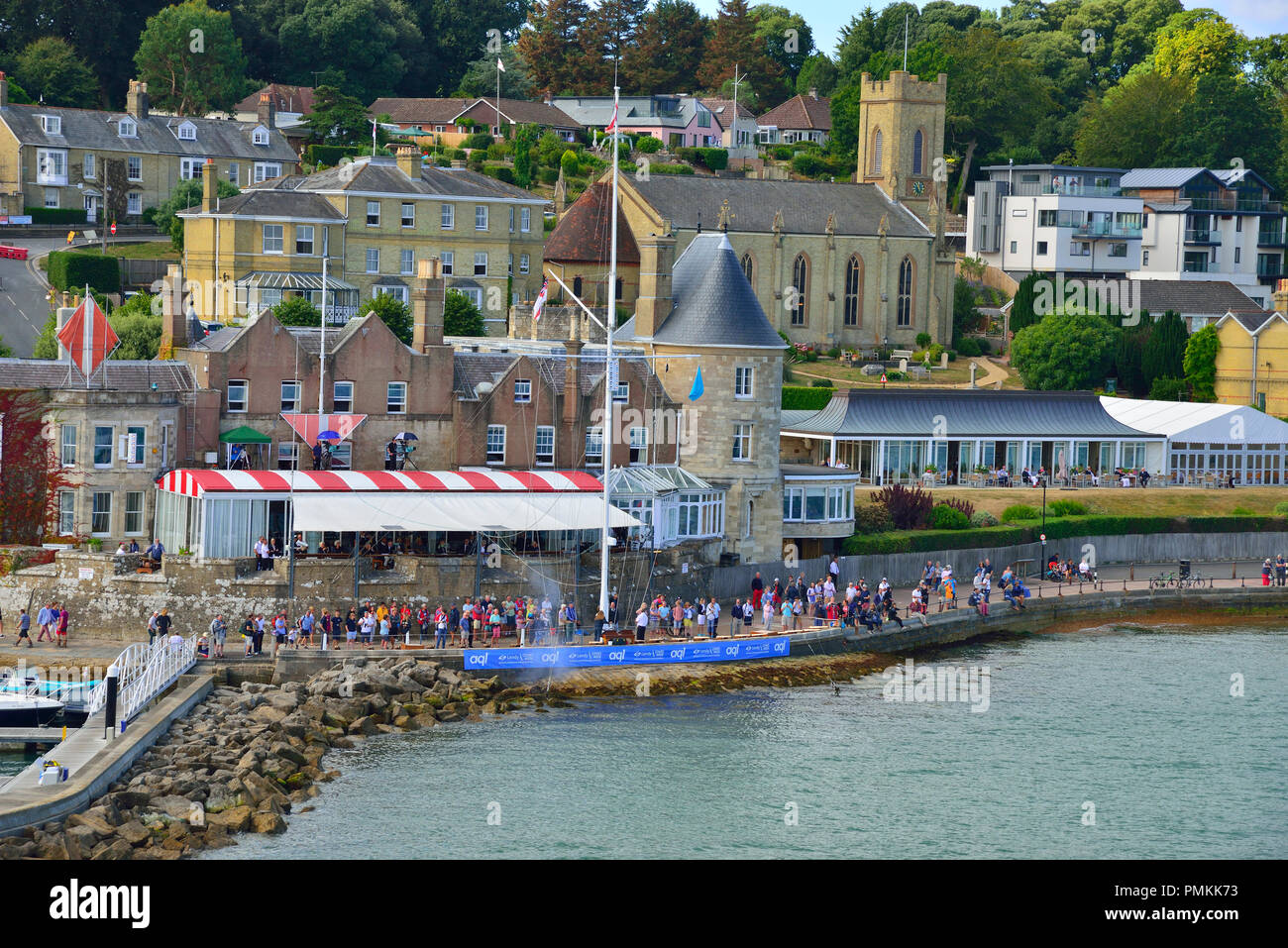 Spectators on the start line in front of the Royal Yacht Squadron during Lendy Cowes Week sailing regatta, Cowes, Isle of Wight, UK Stock Photo