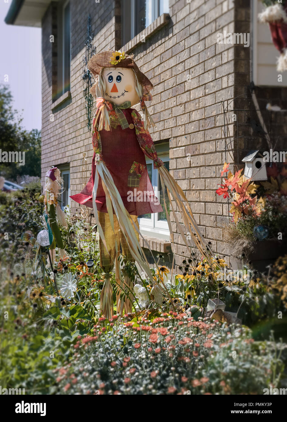 Halloween, outside decorations, straw man, scarecrows in front of the house. Stock Photo