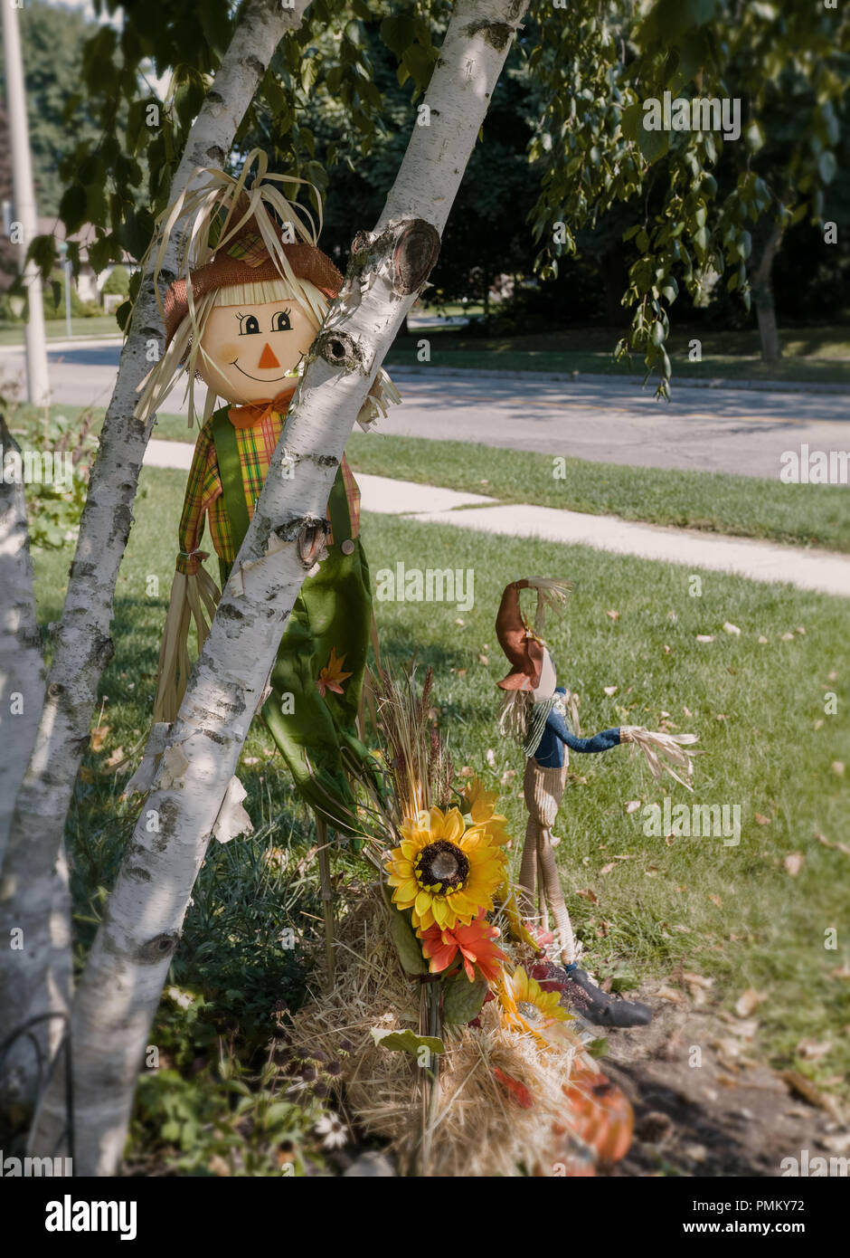 Halloween, outside decorations, straw man, scarecrows. Stock Photo