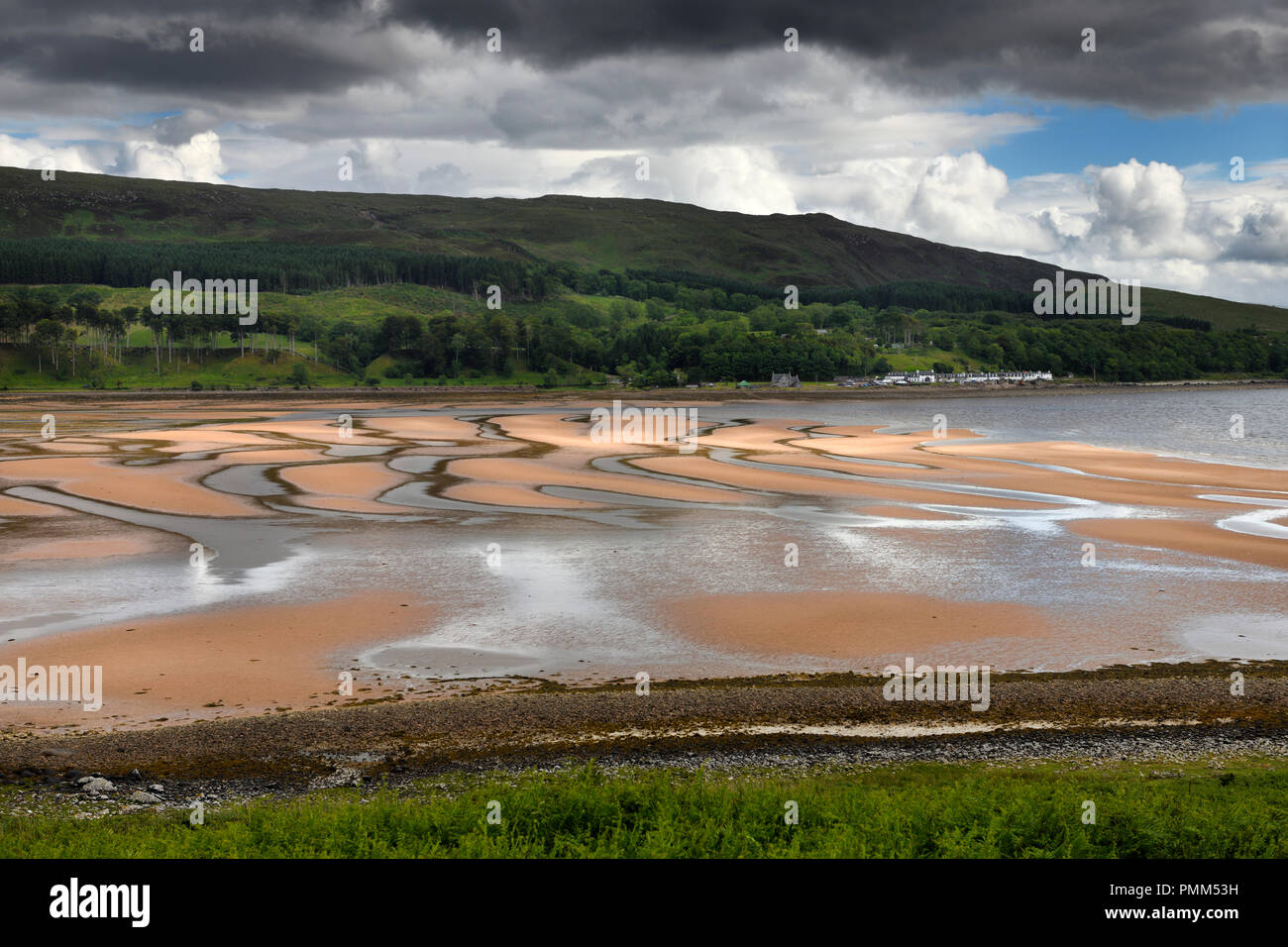 Patterns of red sand at low tide on Applecross Bay of Inner Sound of the Scottish Highland Mainland Scotland UK Stock Photo