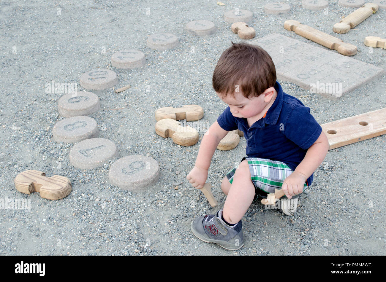 little boy playing in the dirt Stock Photo Alamy