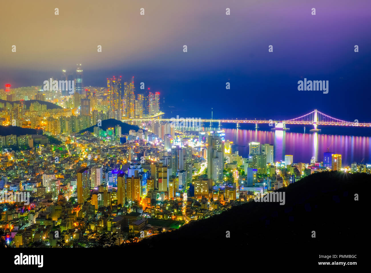 Aerial view of Busan city with Gwangan bridge at nighttime, South Korea ...