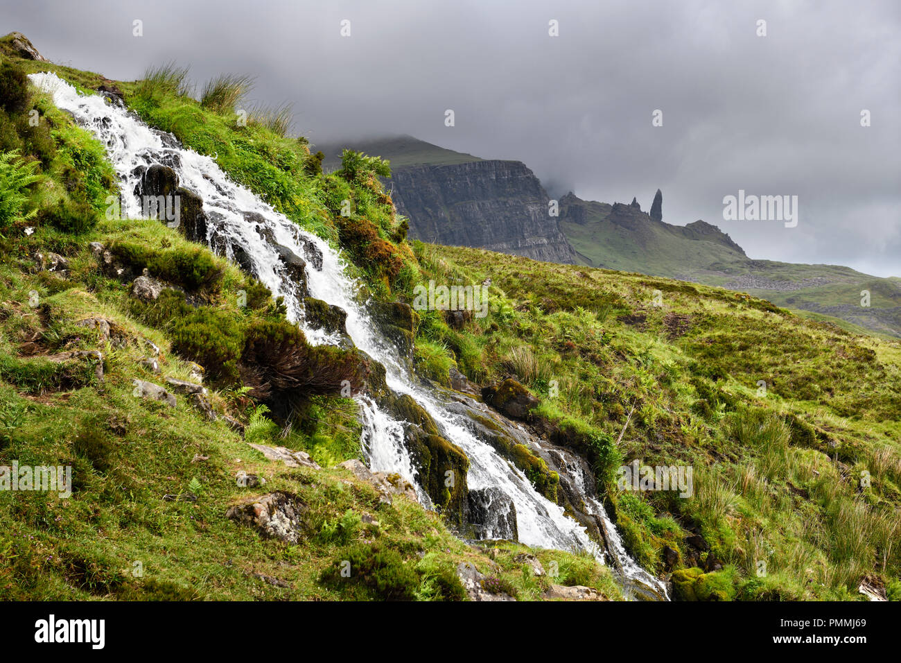 Brides Veil WaterFalls creek to Loch Leathan at The Storr with Old Man of Storr peak in clouds on Isle of Skye Inner Hebrides Scotland UK Stock Photo