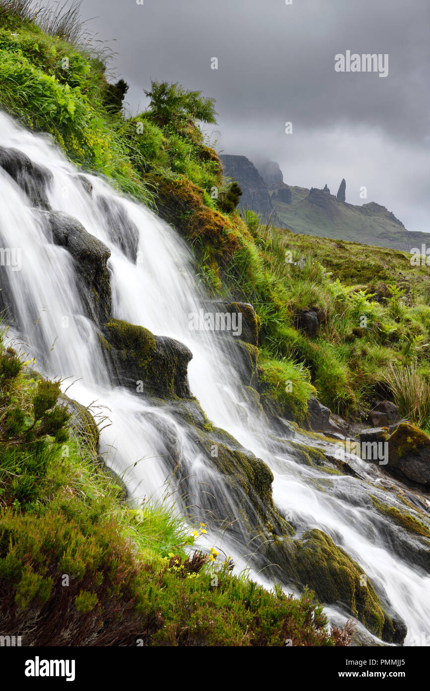 Bride's Veil WaterFalls to Loch Leathan at The Storr with Old Man of Storr peak in clouds on Isle of Skye Inner Hebrides Scotland UK Stock Photo