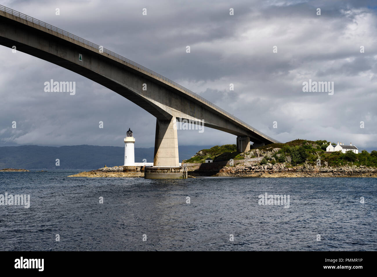 Skye Bridge over Kyle Akin Strait from Inner Sound to Loch Alsh and Eilean Ban Island with white Kyleakin lighthouse and cottages Scotland Stock Photo