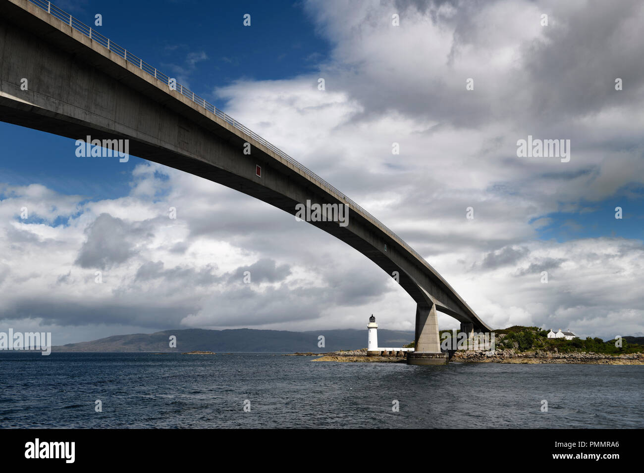 Skye Bridge over Kyle Akin Channel of Inner Sound to Loch Alsh and Eilean Ban Island with white Kyleakin lighthouse and cottages Scotland Stock Photo
