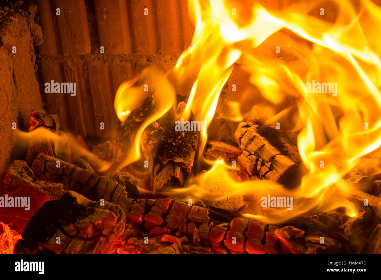 Burning red charcoal in the fireplace background Stock Photo Alamy