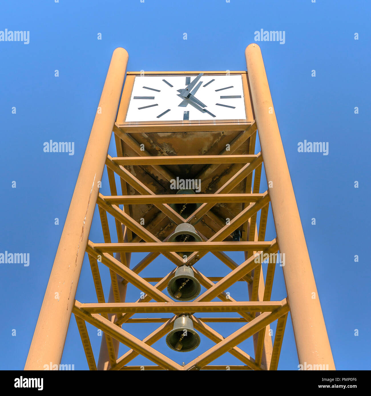 Clock tower with bells under a blue sky Stock Photo Alamy