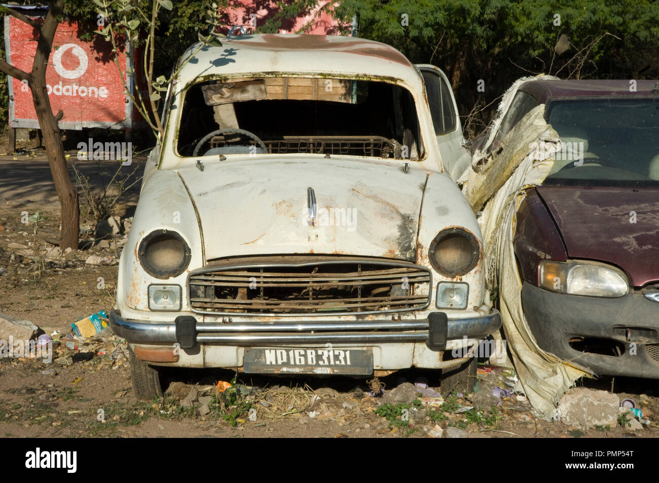 Rusty old car wreck abandoned at khajuraho india Stock Photo