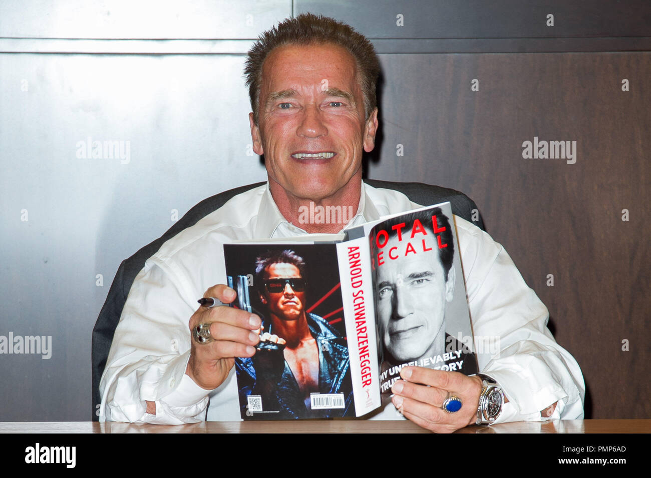 Arnold Schwarzenegger signs copies of his new book 'Total Recall: My ...