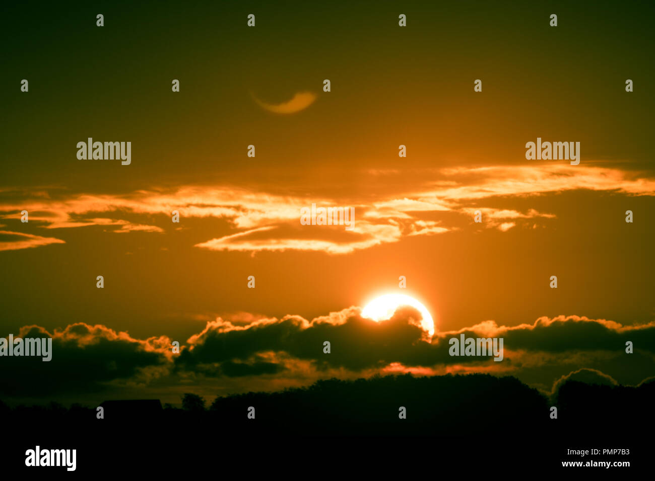Bright big sun on the sky with clouds Stock Photo