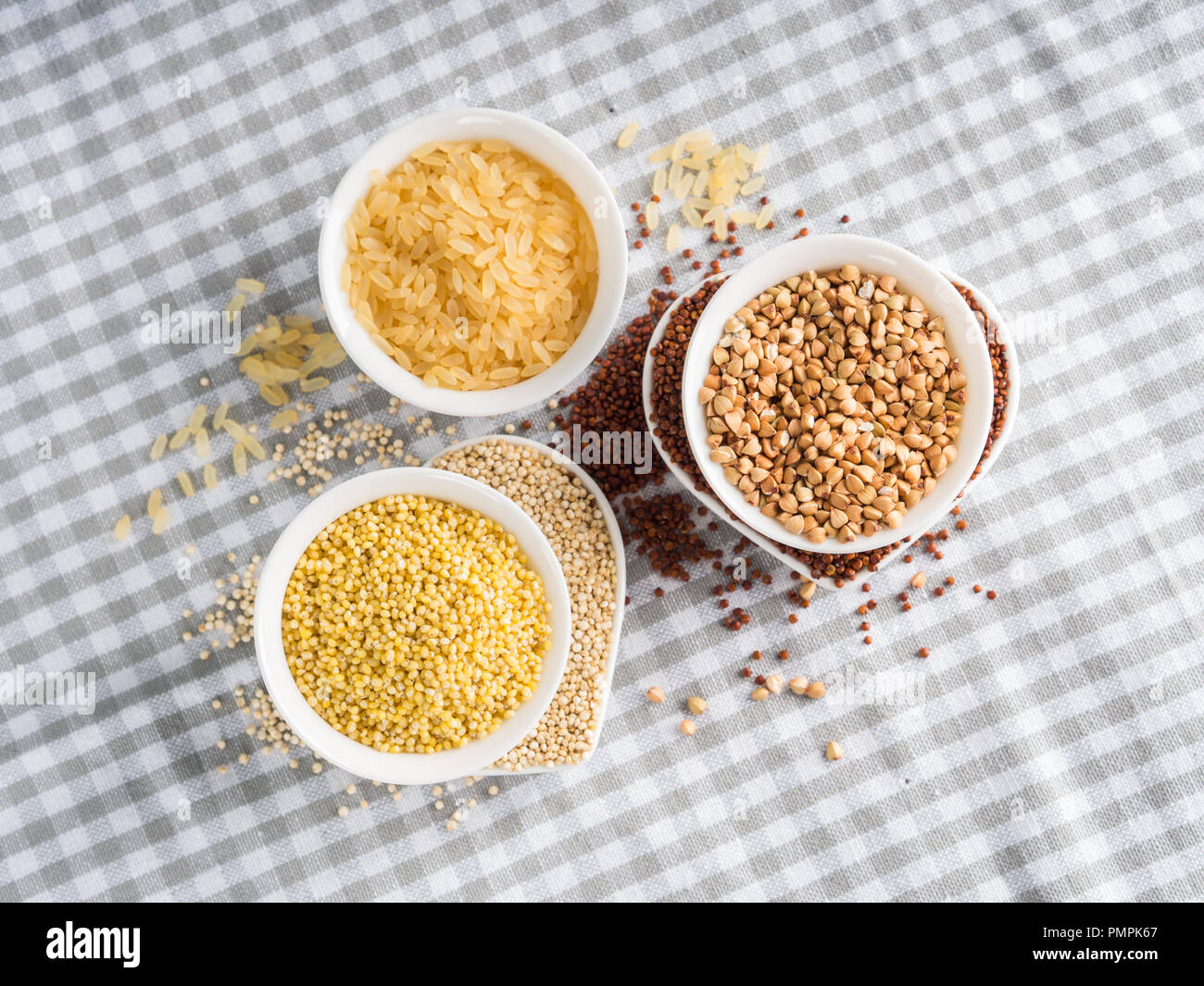 Gluten free grains quinoa, rice, buckwheat, amaranth, millet in bowls