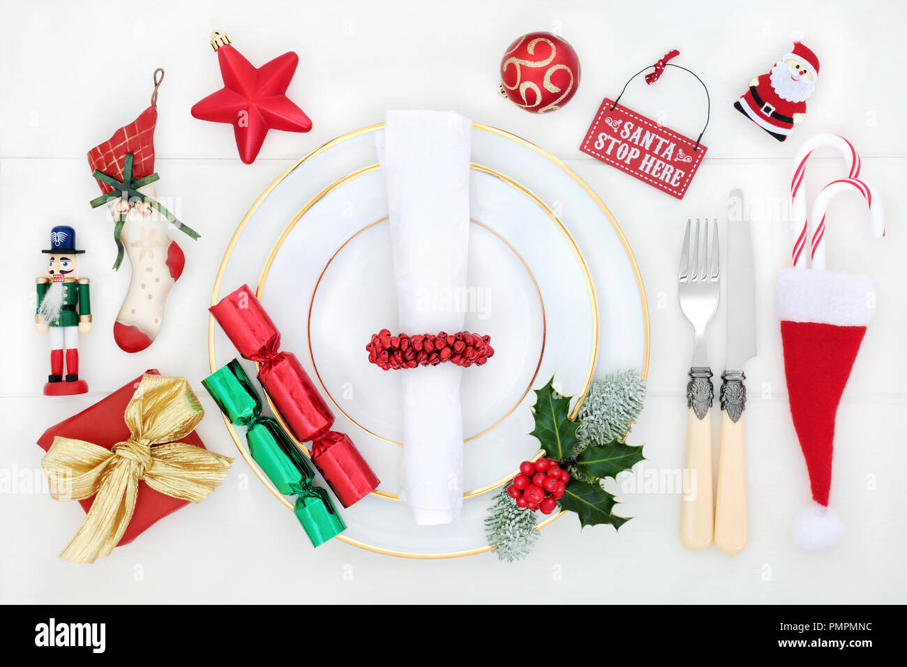 Christmas dinner fun table setting with porcelain plates, bauble ...