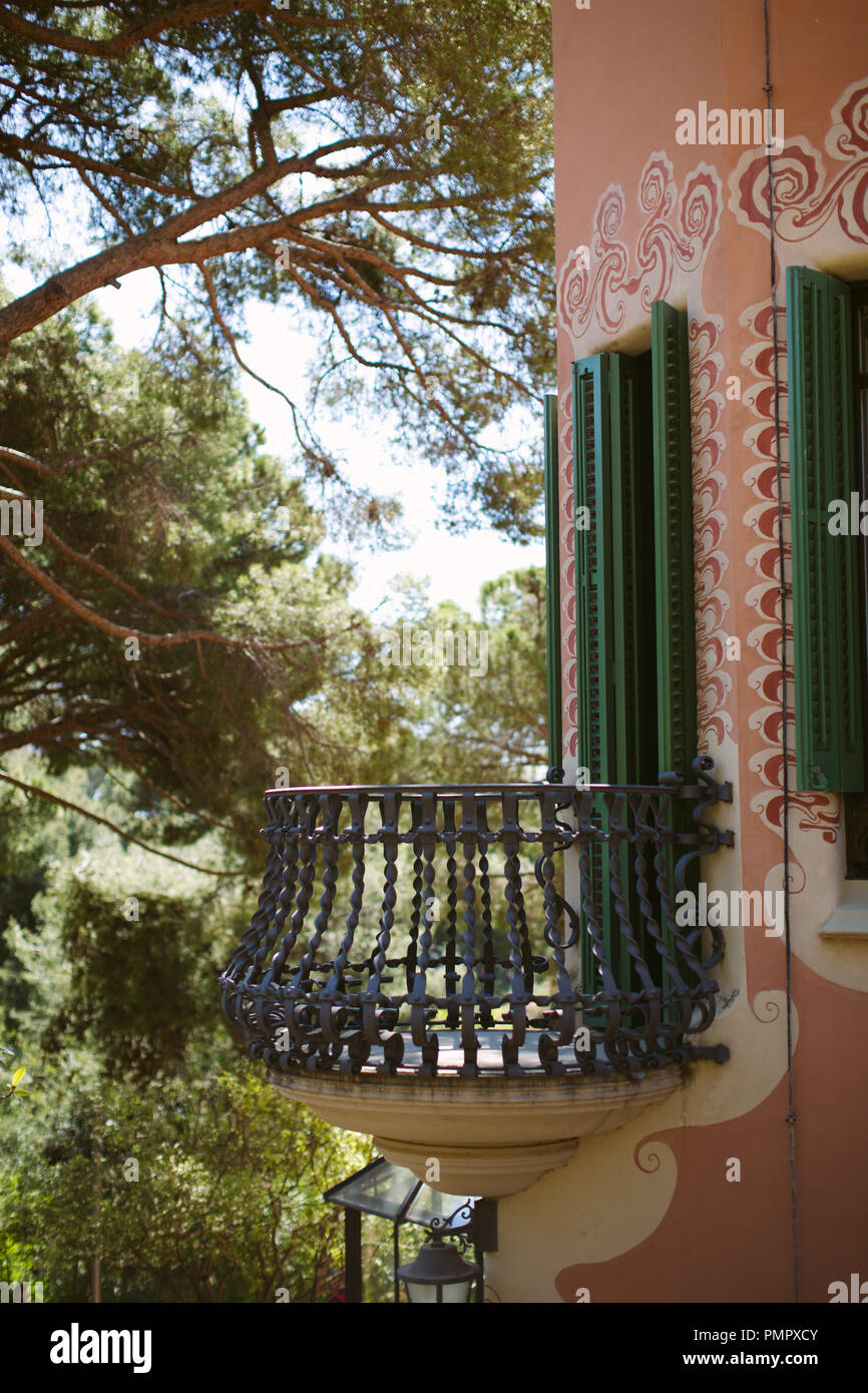 A decorative wrought iron balcony on an outside wall of the Gaudi House Museum, Gaudi's home, in Parc Guell, Barcelona Stock Photo