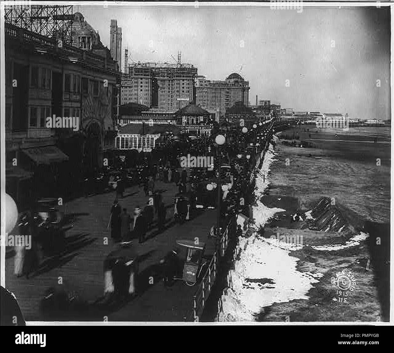 Bird'seye view of Easter Parade on boardwalk and man making a sand