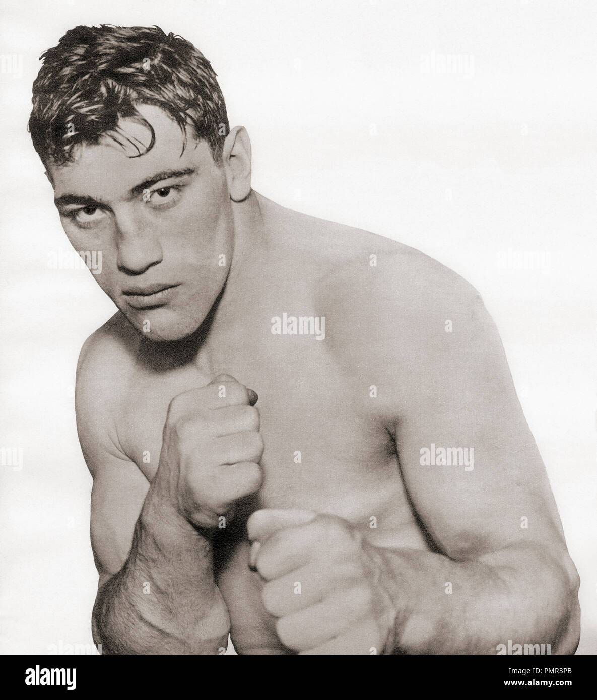 Primo Carnera, 1906 – 1967, nicknamed the Ambling Alp. Italian professional boxer and the World Heavyweight Champion from 29 June 1933 to 14 June 1934.  From These Tremendous Years, published 1938. Stock Photo