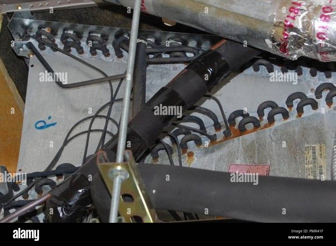 Blackened and corroded copper coils on conditioner unit Chinese