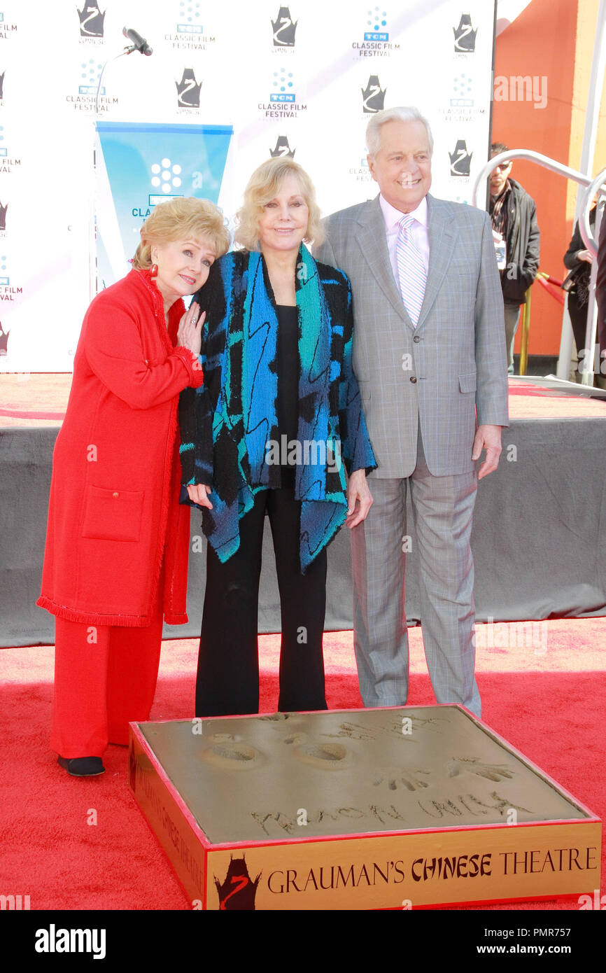 Debbie Reynolds, Kim Novak and Robert Osborne at the Handprint and Footprint Ceremony honoring Kim Novak in cement at Grauman's Chinese Theatre in Hollywood, CA, April 14, 2012. Photo by Joe Martinez / PictureLux Stock Photo