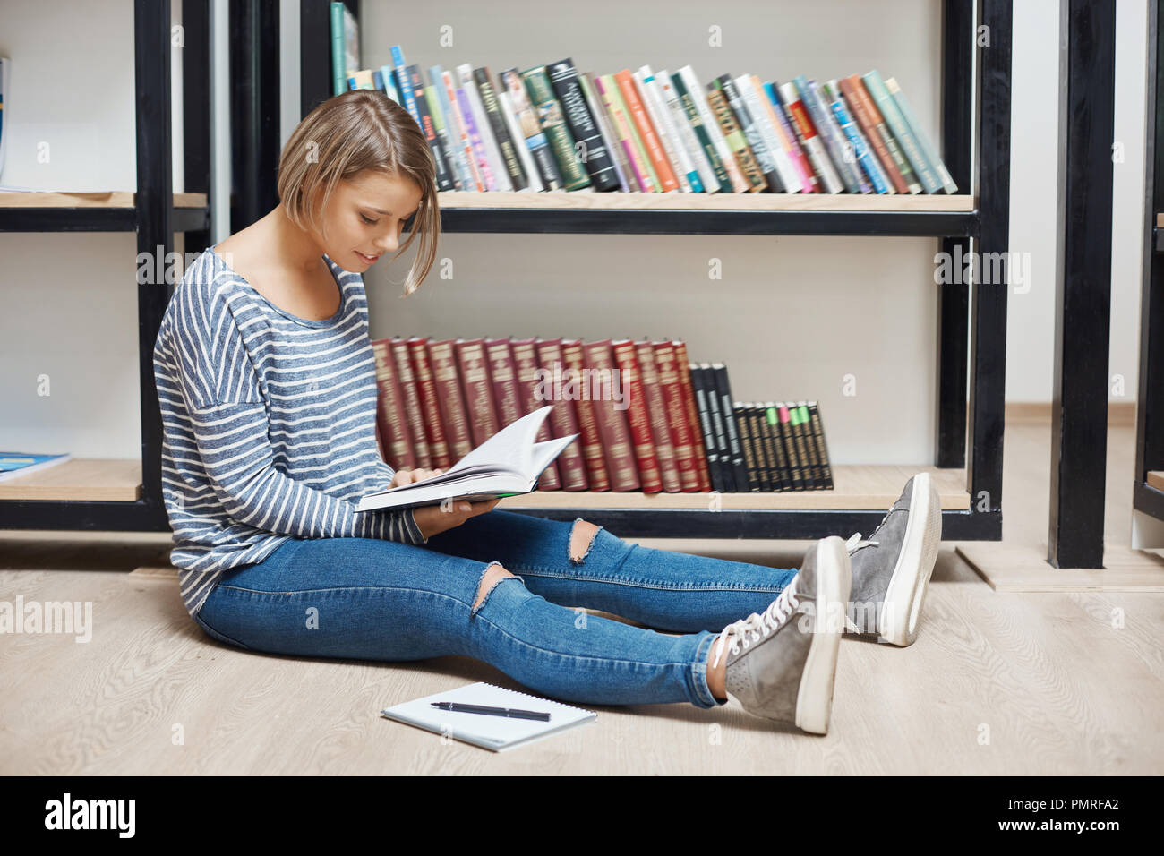 Young Cheerful Light Haired Student Girl With Short Hair In