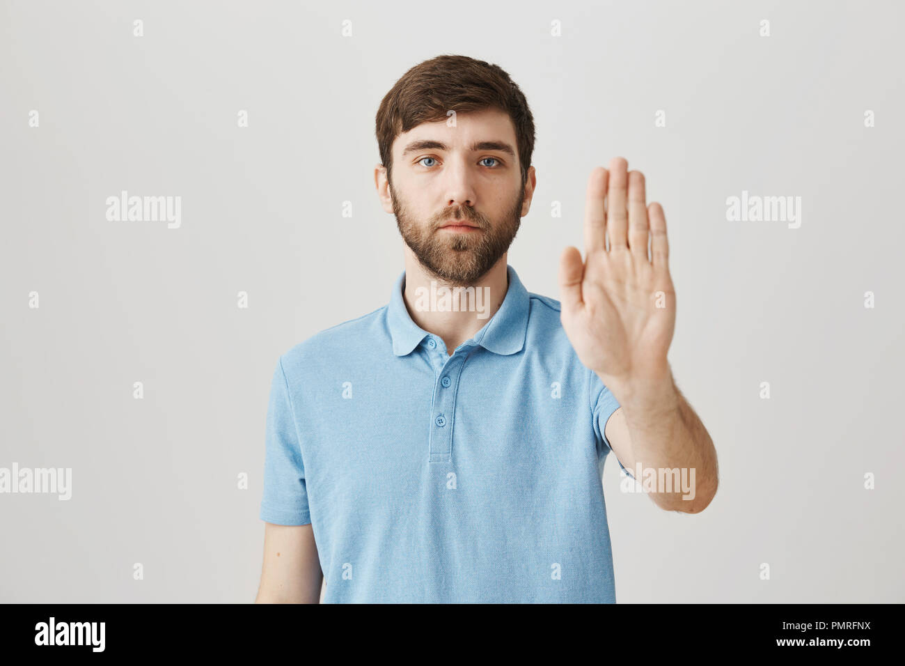 Body language and emotions concept. Calm and determined caucasian guy ...